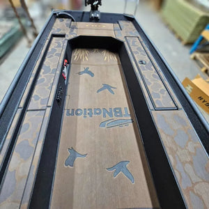 Custom 1436 duck boat deck with espresso over black camo HydroTurf, laser-engraved ducks, and "TBNation" logo.