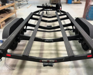 Black boat trailer with Gatorbak GB350 XP synthetic bunk covers for 2x4 flat bunks.