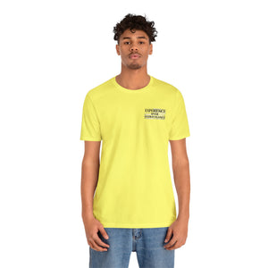 Man in a yellow "American Dreamer" t-shirt with "EXPERIENCE OVER EXTRAVAGANCE" text.