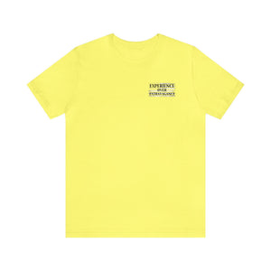 Yellow unisex short sleeve t-shirt with "EXPERIENCE OVER EXTRAVAGANCE" text on the left chest.