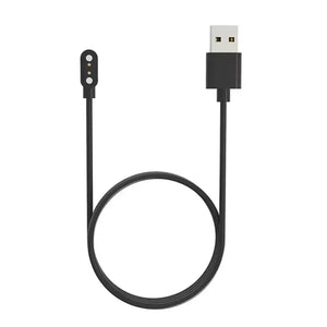 A black USB cable with a white charging port, coiled neatly on a light background.