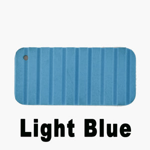 Light blue Hydro Turf Cut Groove EVA foam traction mat sample with a hole.