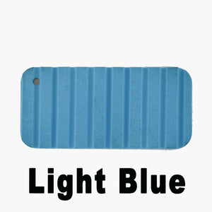 Light blue Hydro Turf Cut Groove EVA foam traction mat sample with a hole.
