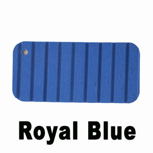 Royal Blue Hydro Turf Cut Groove EVA foam traction mat sample with a hole.