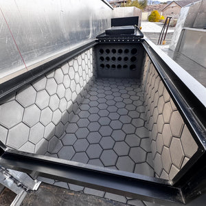 Dark gray Hydro Turf Pro Series EVA foam mat with a textured honeycomb pattern lining a boat compartment.