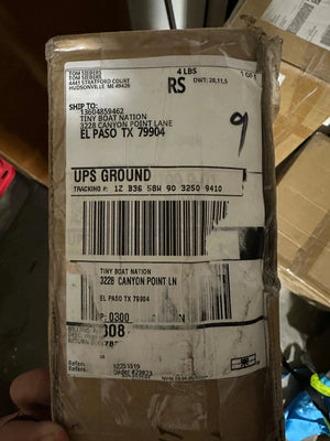 UPS shipping label on a package with shipping details.