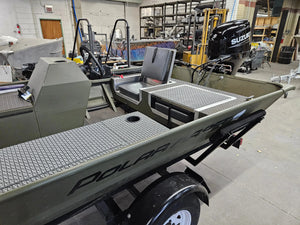 Olive green boat interior with a flip-up stowable seat and textured gray EVA foam flooring.