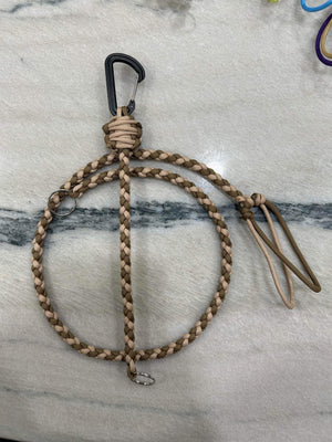 Braided tan and brown paracord key lanyard with a black carabiner and metal kill switch clip.