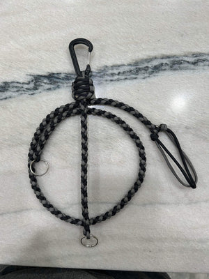 Black and gray braided paracord key lanyard with a black carabiner and two silver keyrings.