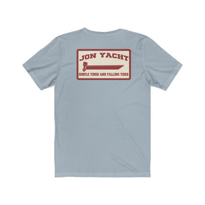 Light blue soft cotton jersey tee with "Jon Yacht" boat graphic and "Simple Times and Falling Tides" text on back.