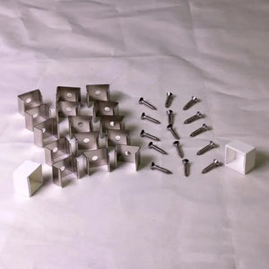 Metal mounting clips, screws, and white end caps for MEGA LED Neon Flex.
