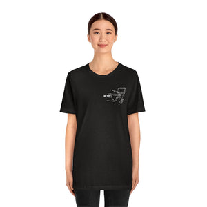 Woman wearing a black MERC Tiller t-shirt with a white outline graphic of a boat motor.