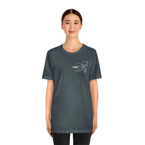Woman wearing a charcoal gray cotton tee with a white MERC Tiller outboard motor graphic.