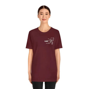 Woman wearing a maroon MERC Tiller graphic tee made from soft Airlume combed and ringspun cotton.