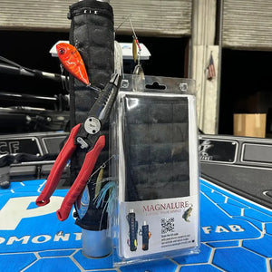 Black Magnalure magnetic wrap on a boat pedestal, holding lures, hooks, and red pliers.