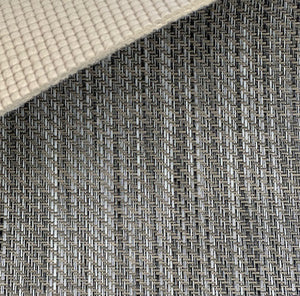Close-up of MariDeck Ultra Premium Vinyl Boat Flooring, showing the woven texture in gray and black, with a beige padded backing.