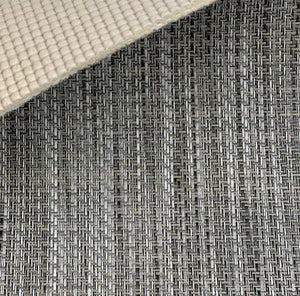 Close-up of MariDeck Ultra Premium Vinyl Boat Flooring, showing the woven texture in gray and black, with a beige padded backing.