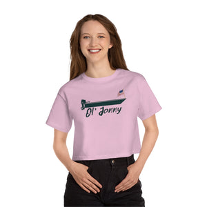 Smiling woman in a pink Champion cropped t-shirt with "Ol' Jonny" boat graphic and US flag.