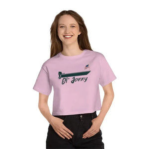 Smiling woman in a pink Champion cropped t-shirt with "Ol' Jonny" boat graphic and US flag.