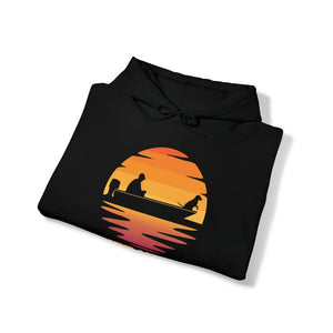 Black Ol Yeller Hoodie with a sunset graphic featuring a person and dog in a boat.