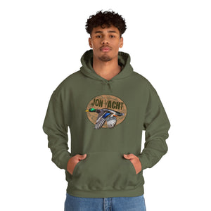 Man in an olive green cotton-polyester hoodie with a "Jon Yacht" logo and flying mallard duck graphic.