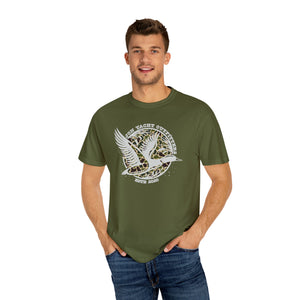 Man in olive green Comfort Colors t-shirt with "Jon Yacht Outfitters" flying duck logo.