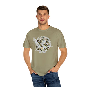Man in a relaxed-fit, garment-dyed olive t-shirt with a "Jon Yacht Outfitters" duck graphic.