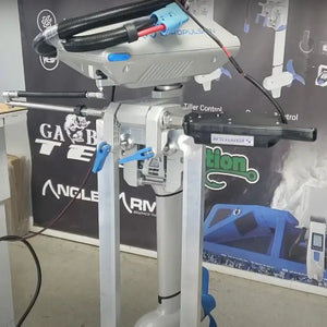 Silver Panther T4 Electro Steer kicker motor with black cables and blue connectors, mounted on a stand.