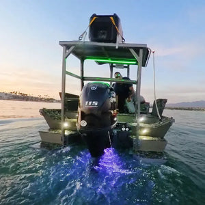 Boat with Plashlights EPIK underwater transom lights glowing blue, green deck lights, and a Yamaha 115 outboard.