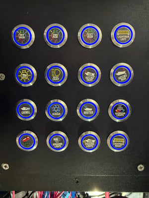 Plashlights REVERT 22mm marine switches with blue LED rings, custom labels, and metal bodies on a black panel.