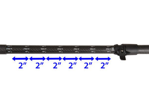 Black carbon-fiberglass paddle shaft with white measurement markings and a lever lock mechanism.