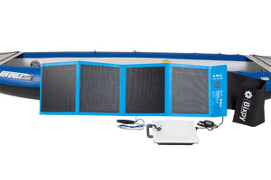 Blue Bixpy 80W solar panel, white K-1 motor, and black storage bag in front of a blue Sea Eagle kayak.