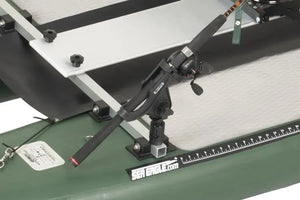Black Scotty Gear Head track adapter holding a fishing rod on a green Sea Eagle kayak.