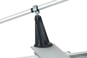 Black engineering plastic oarlock, angled for rowing, mounted on a silver boat frame with a silver oar.