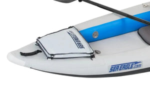 Light gray Sea Eagle Stow Bag on a white inflatable kayak, secured with bungee cords.