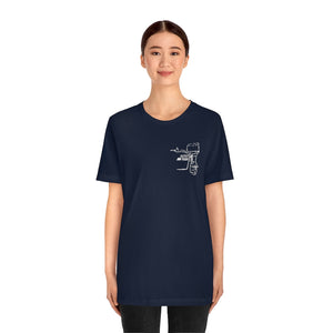 Woman wearing a navy blue cotton tee with a white square body tiller graphic on the left chest.