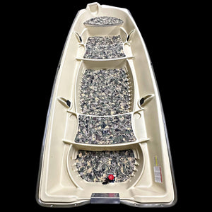 Overhead view of a beige Sun Dolphin American 12 boat with camouflage EVA foam flooring installed.