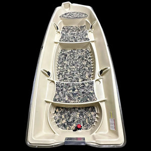 Overhead view of a beige Sun Dolphin American 12 boat with camouflage EVA foam flooring installed.