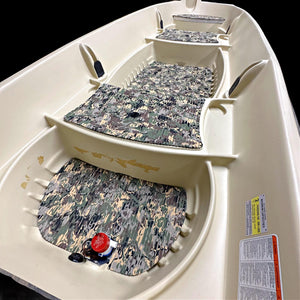 Beige Sun Dolphin American 12 boat interior with three camouflage EVA foam floor mats.