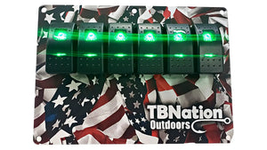 TBNation 6-gang rocker switch panel with green illuminated switches on an American flag hydro-dipped aluminum plate.