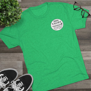 Green soft cotton t-shirt with "Jon Yacht The Original Flats Skiff" logo, styled on wood.