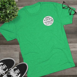 Green soft cotton t-shirt with "Jon Yacht The Original Flats Skiff" logo, styled on wood.
