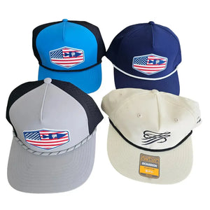 Four TTP Outdoors hats: blue, navy, grey, and cream. Blue, navy, and grey feature an American flag fish logo; cream has a script logo.
