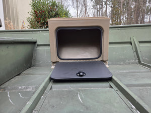 Tan universal jon boat tiller console with open black lid and latch, mounted on a green boat.