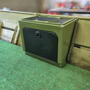 Olive green universal jon boat tiller console with a black storage door and top mounting surface.