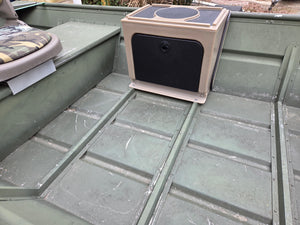 Tan Revolution Products Universal Jon Boat Tiller Console with black storage door and top pad, installed in a green jon boat.