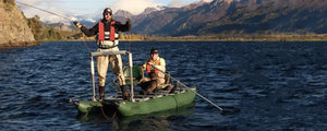 Dark Hunter Green Sea Eagle 375fc FoldCat inflatable fishing boat with two men fishing on a lake.