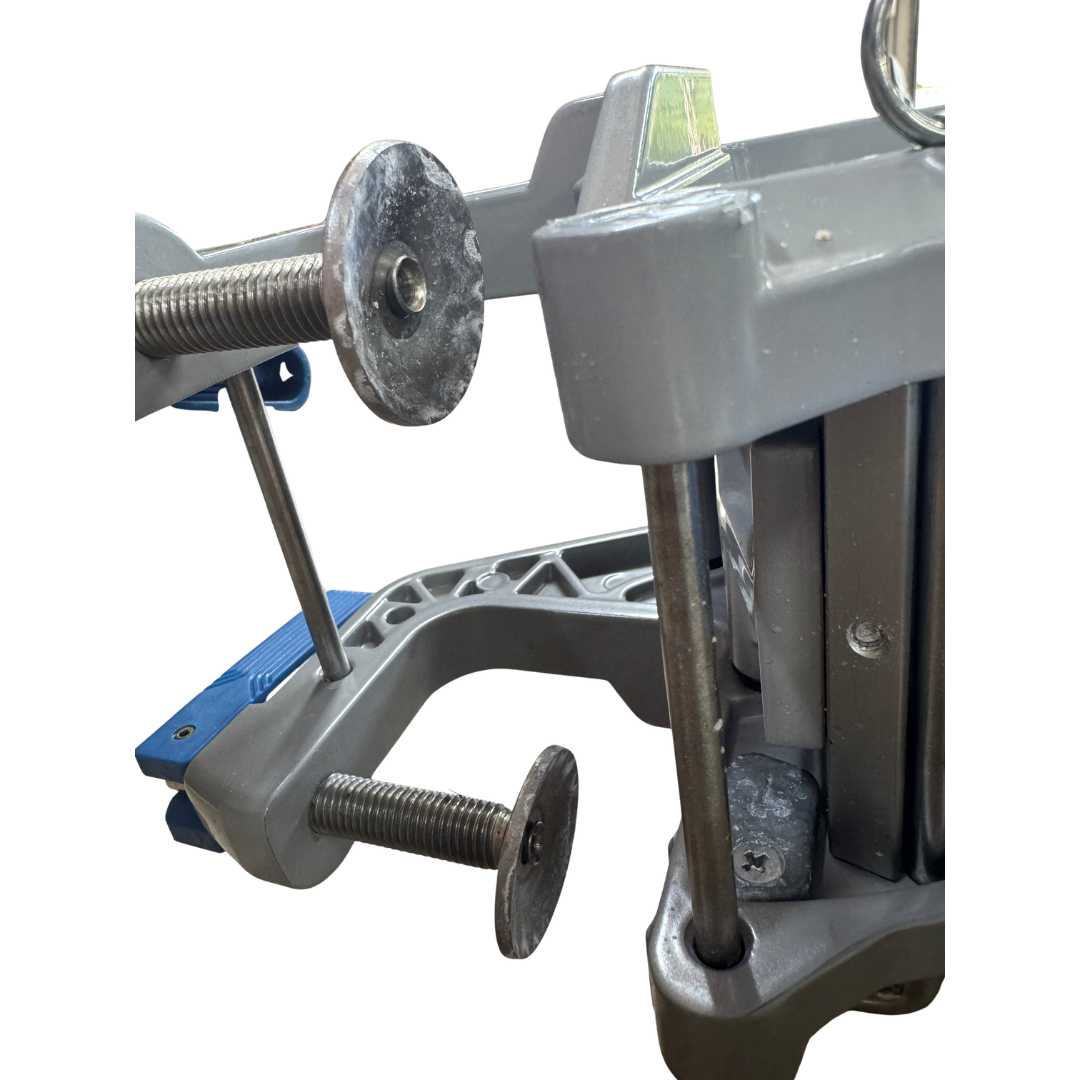 Close-up of a epropulsion gray and blue clamp-like mechanical device with threaded rods and circular metal discs on a plain white background.
