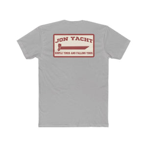 A light gray short-sleeve t-shirt shown from the back, featuring a rectangular vintage-style graphic print in red and cream with the text 'JON YACHT' and 'SIMPLE TIDES AND FALLING TIDES'.