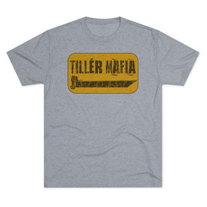 A heather gray short-sleeve crewneck t-shirt featuring a distressed yellow rectangular graphic on the chest with the text 'TILLÉR MAFIA' in black.
